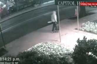 A dark, blurry security camera screenshot labeled "CAPITOL" with a timestamp of 8:14:21 p.m. and the location "am First St SE," noting the video has no sound.