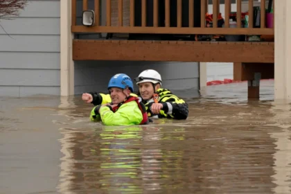 Rescue personnel prepare to evacuate residents from a home in an area flooded by the Snohomish River on 11 December.