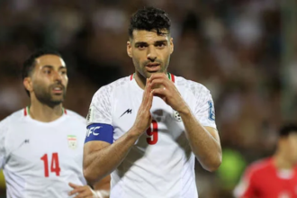 Iran’s Mehdi Taremi celebrates after scoring the second goal in Group A match against North Korea on June 10, 2025.