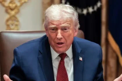 US President Donald Trump gestures as he attends a roundtable discussion on the day he announced an aid package for farmers, at the White House in Washington, DC, US
