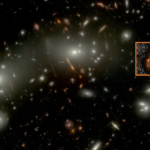 A deep space field image featuring countless galaxies, with a highlighted box showing a magnified, red, and irregularly shaped galaxy.