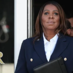 “Attorney general standing outside a building during coverage of the Letitia James indictment decision.”