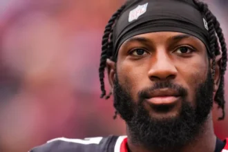 Close-up of an NFL player looking focused on the field