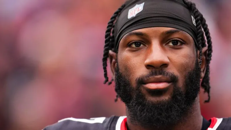 Close-up of an NFL player looking focused on the field