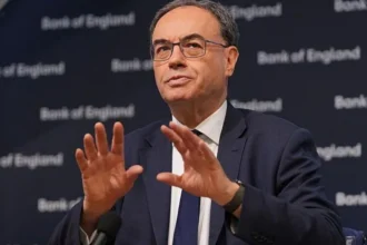 Bank of England governor warns AI may displace jobs, urges training and skills development while highlighting economic growth potential.