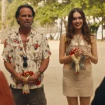 Netflix and Paramount logos facing off with Warner Bros building in background