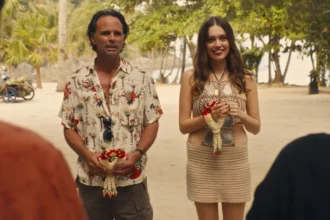 Netflix and Paramount logos facing off with Warner Bros building in background