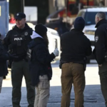 Providence police release surveillance image of a masked person of interest connected to the Brown University shooting investigation.