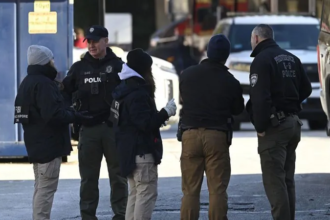 Providence police release surveillance image of a masked person of interest connected to the Brown University shooting investigation.