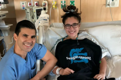Brown University student Mia Tretta smiles in a hospital bed while recovering after surviving the 2019 Saugus High School mass shooting