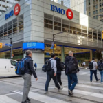 Aerial view of downtown Toronto with Canadian flag overlay, representing population decline and immigration changes in Canada