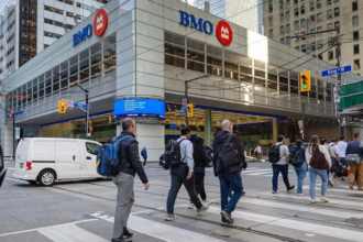 Aerial view of downtown Toronto with Canadian flag overlay, representing population decline and immigration changes in Canada