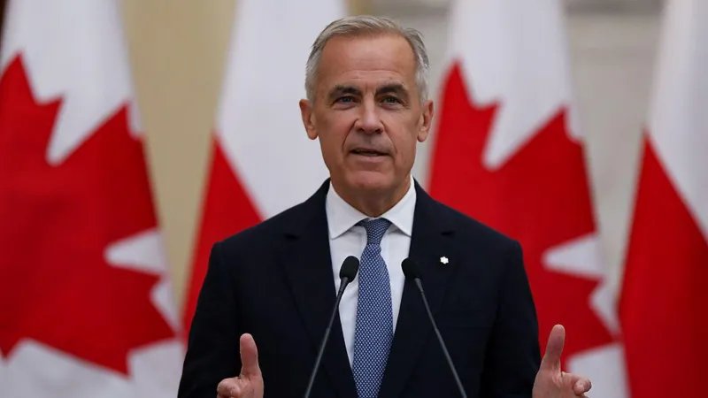 Canada’s prime minister speaks during an official address with Canadian flags in the background amid debate over British versus Canadian spelling