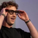 Meta boss Mark Zuckerberg showing off a pair of Meta's smart glasses.