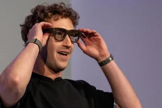 Meta boss Mark Zuckerberg showing off a pair of Meta's smart glasses.