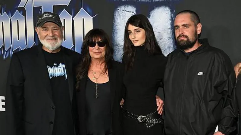A group of family members posing together at a Hollywood film premiere event, shown amid news of murder charges filed in a high-profile Los Angeles case.