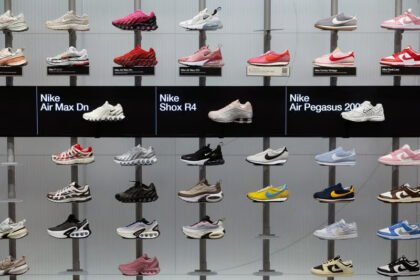 Nike storefront with running shoes on display as the company reports stronger than expected quarterly revenue