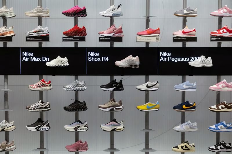 Nike storefront with running shoes on display as the company reports stronger than expected quarterly revenue