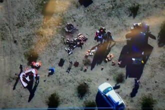 Aerial view of FBI and law enforcement officers arresting suspects in a desert area east of Los Angeles during the disruption of a New Year’s Eve terror plot