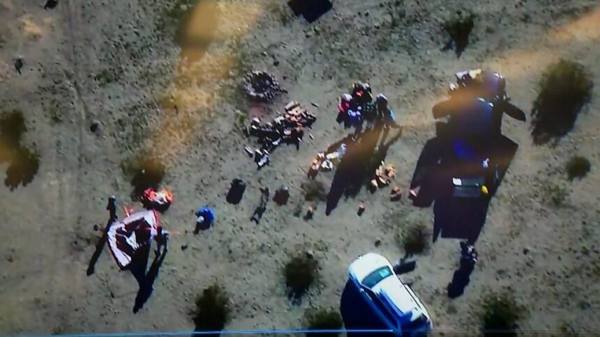 Aerial view of FBI and law enforcement officers arresting suspects in a desert area east of Los Angeles during the disruption of a New Year’s Eve terror plot