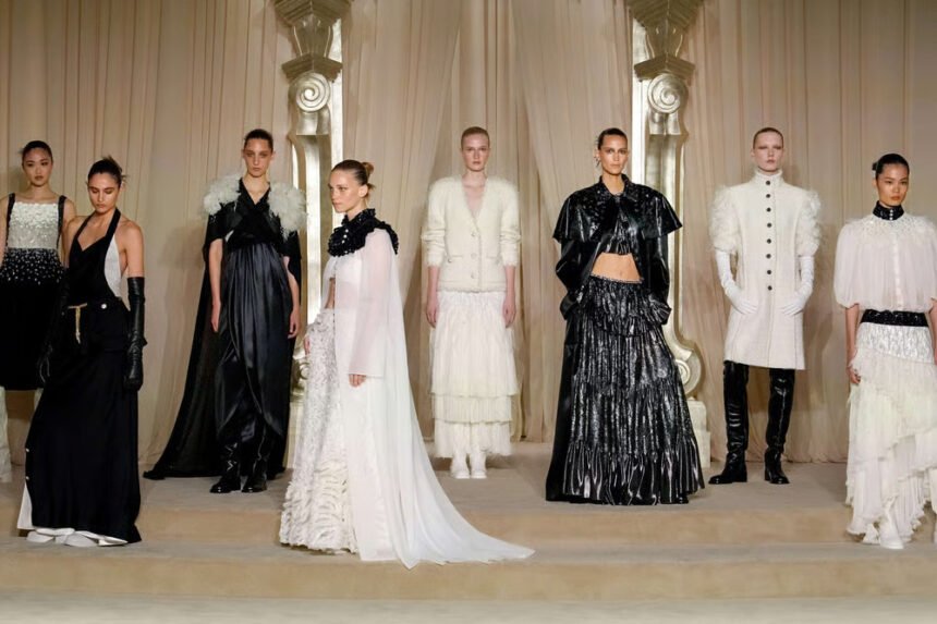 Models walk the runway during Paris Couture season as leading fashion houses present January collections