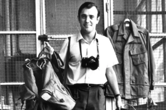 Peter Arnett, Pulitzer Prize winning war correspondent, during field reporting in a conflict zone