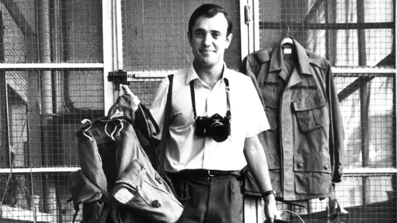 Peter Arnett, Pulitzer Prize winning war correspondent, during field reporting in a conflict zone