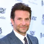 Bradley Cooper in blue blazer at Is This Thing On? premiere with Laura Dern