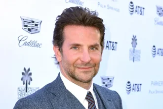 Bradley Cooper in blue blazer at Is This Thing On? premiere with Laura Dern