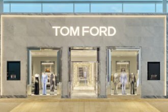 Interior view of Tom Ford luxury boutique at Yorkdale Shopping Centre in Toronto, showcasing elegant displays, marble and ebony accents, and luxury fashion collections for men and women