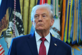 President Donald Trump signing documents while rejecting bipartisan bills on Colorado water funding and Florida tribe flood mitigation