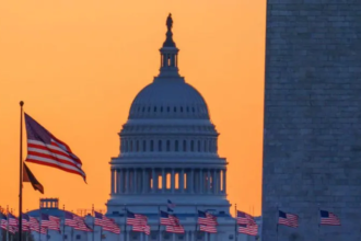US Capitol building at sunset with American flags in the foreground, representing the House vote on healthcare subsidies