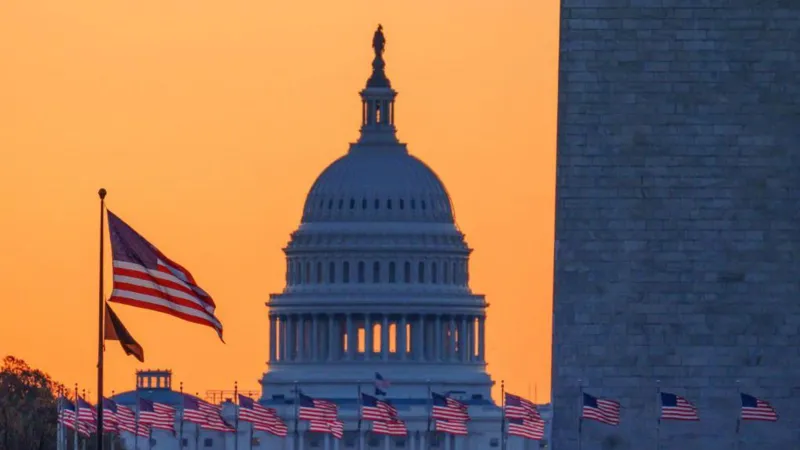 US Capitol building at sunset with American flags in the foreground, representing the House vote on healthcare subsidies