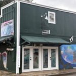 Boardriders flagship store in Waikīkī, Hawaii, showcasing surf and action sports brands like Quiksilver, Billabong, Volcom, Roxy, and RVCA.
