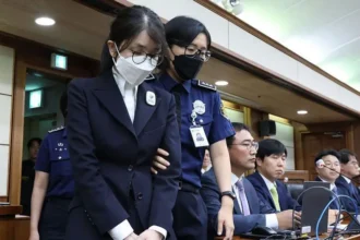 A string of scandals and luxury handbags