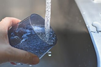 PFAS contamination in Australian drinking water affects communities nationwide, driving new guidelines, testing, and treatment measures.