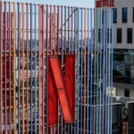 Netflix’s ad-supported plan grows, boosting revenue and subscribers while narrowing the gap with its standard no-ads tier.