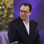 OpenAI and Anthropic focus on enterprise AI growth, gaining thousands of business clients and expanding revenue at Davos 2026.