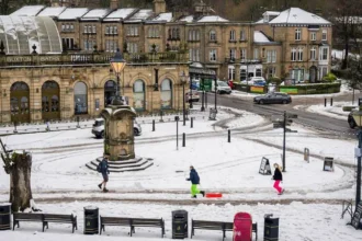 Tens of thousands without power as snow and ice warnings cover most of UK