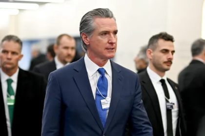 Treasury Secretary Scott Bessent speaking at Davos while criticizing California Governor Gavin Newsom