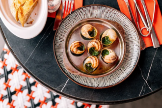 Empty tables in a traditional French bistro reflecting declining business