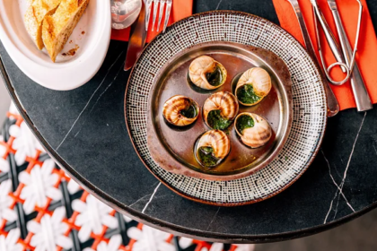 Empty tables in a traditional French bistro reflecting declining business