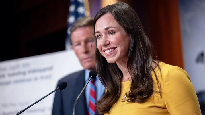 DHS building with a warning sign, representing potential shutdown and funding disputes