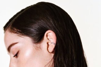 Gracie Abrams smiles while modeling Chanel Coco Crush jewelry after being announced as the new Chanel ambassador.