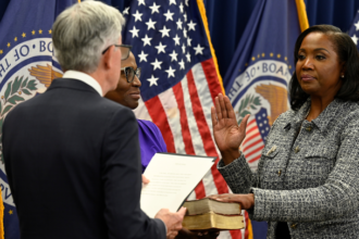 Federal Reserve Governor Lisa Cook speaking at an economic forum