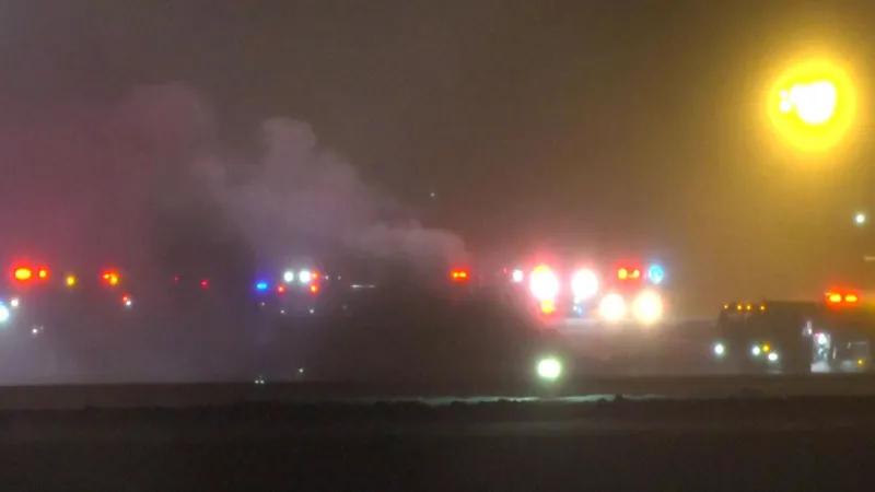 Private jet crash at Bangor International Airport with emergency crews responding amid snow
