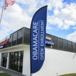 A worried couple reviewing medical bills and health insurance options under Obamacare bronze plans