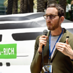 Scott Wiener speaking at a podium, criticizing President Trump’s Venezuela operation and calling for impeachment