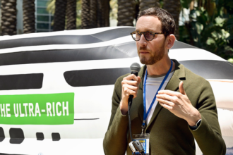 Scott Wiener speaking at a podium, criticizing President Trump’s Venezuela operation and calling for impeachment