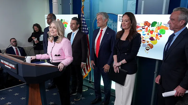 Trump administration officials announce new nutrition guidelines focusing on whole foods, reducing ultra-processed foods, and revising red meat and saturated fat advice